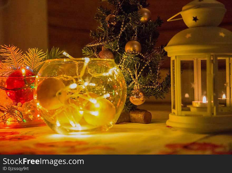 Festive new year mood. The fire candles and light colorful garlands. The approach of Christmas and new year.