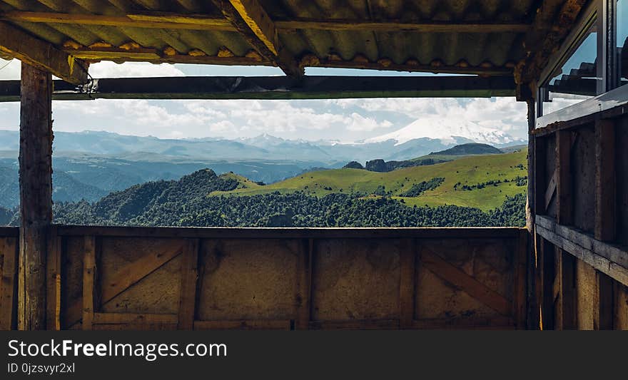 Picturesque View Of Mount Elbrus From The Veranda Windowю Adventure Trip Camping Concept. Picturesque View Of Mount Elbrus From The Veranda Windowю Adventure Trip Camping Concept.