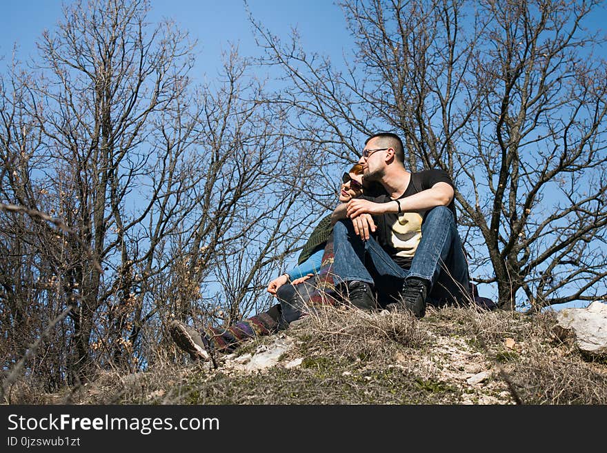 Couple Travelers Man and Woman sitting relax in a hike. Love and Travel happy emotions Lifestyle concept. Young family traveling active adventure.