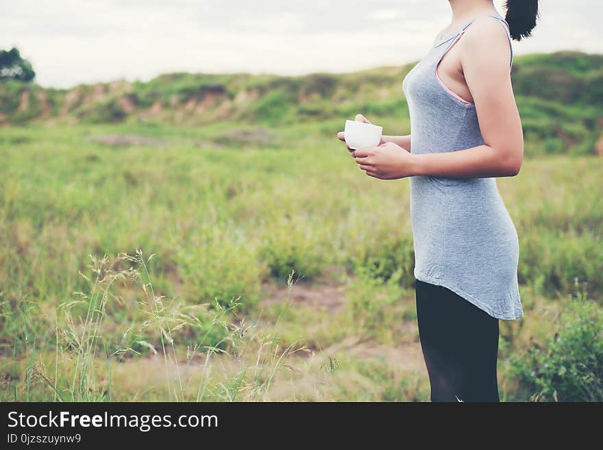 Young beautiful asian woman enjoy life and coffee at meadows in