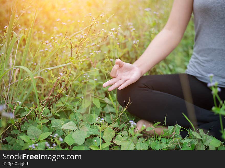 Beautiful Woman In Lotus Position Practicing Yoga.