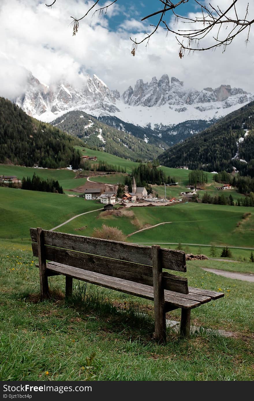 A bench with a view of the mountains. Lookout in the north of Italy. val di funes. Dolomites