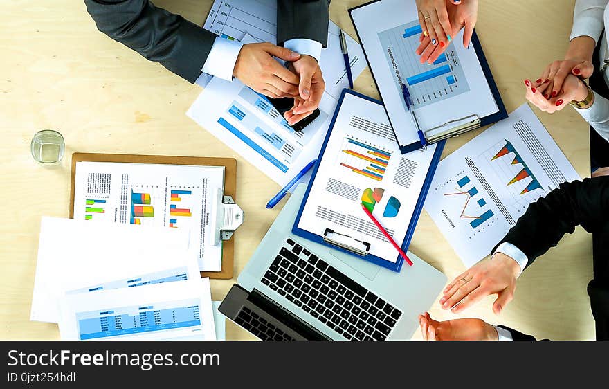 Business people sitting and discussing at business meeting, in office