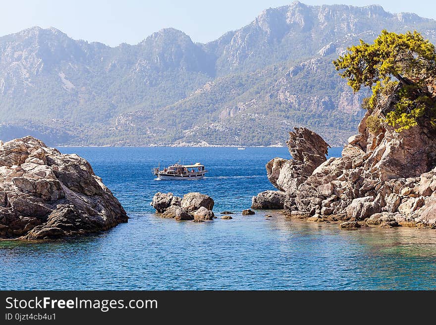 Rocks and boat on the sea.