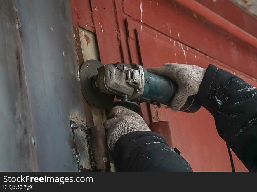 Man conducts welding works outdoors in winter. Man conducts welding works outdoors in winter