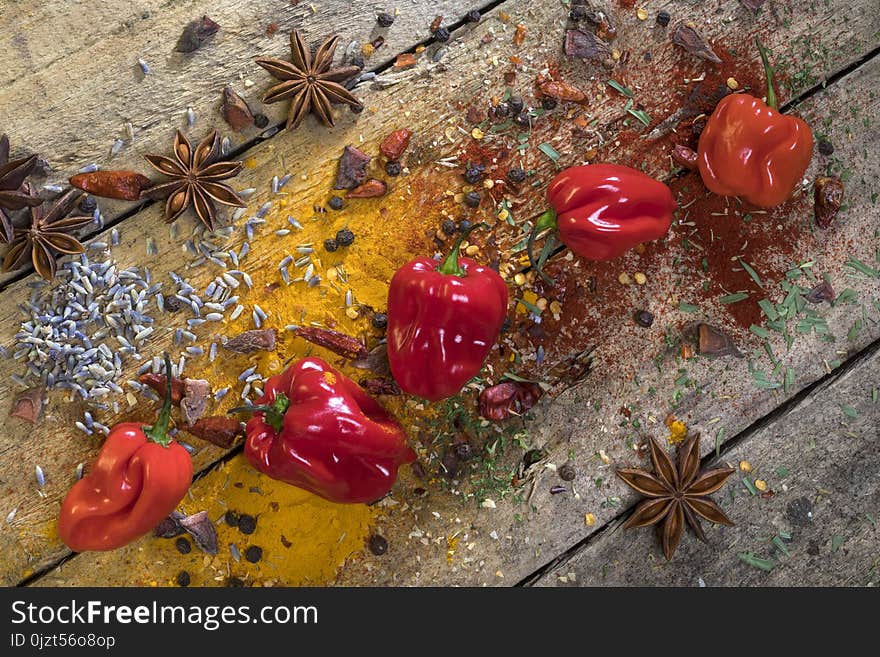 Hot chili peppers on a rustic farmhouse table. Used to add a hot spicy flavor to cooking.