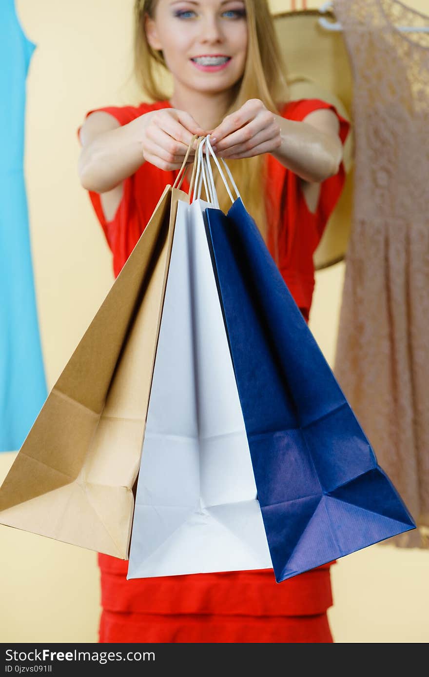 Woman in shop picking summer outfit