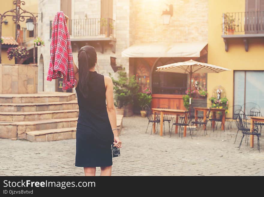 Young beautiful woman with retro camera , Vintage retro style Asian girl on vacation smiling happy.