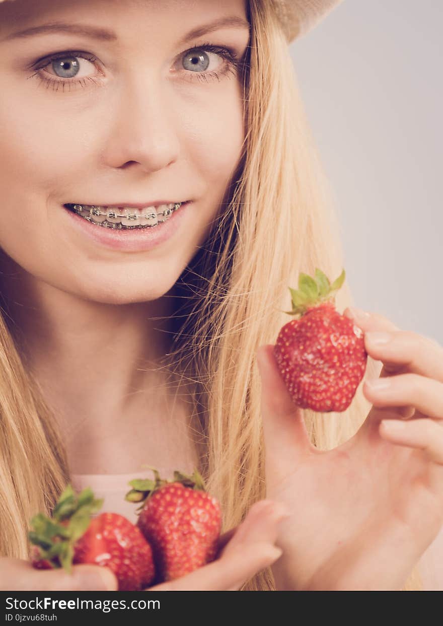 Young woman with fresh strawberries