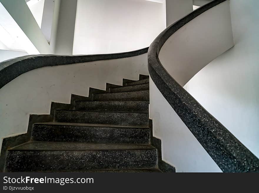 Perspective of black spiral concrete staircase. Perspective of black spiral concrete staircase