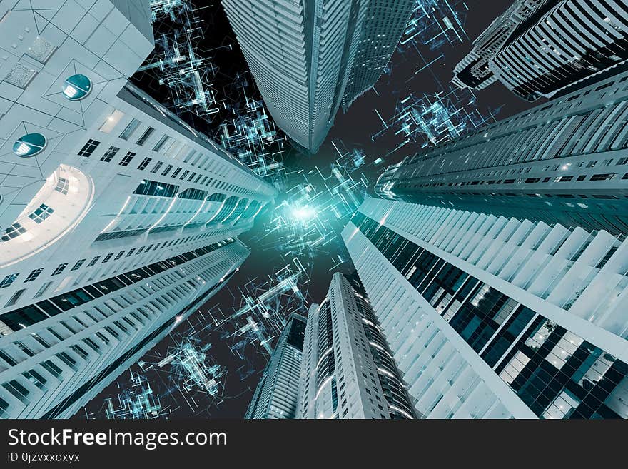 Upward view of futuristic skyscrapers to sky with network connections in global communications. Business concept. Upward view of futuristic skyscrapers to sky with network connections in global communications. Business concept.