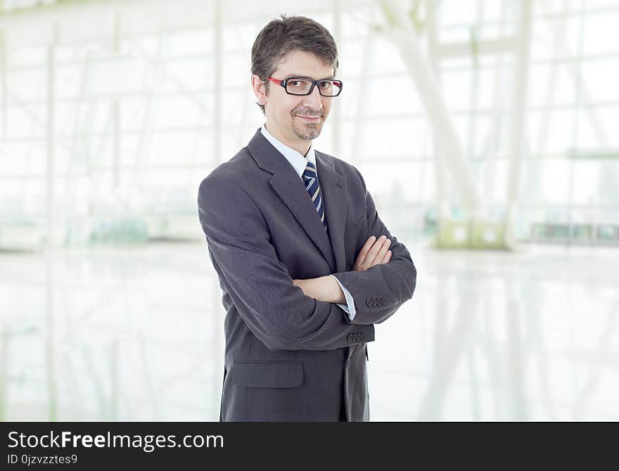 Young business man portrait at the office