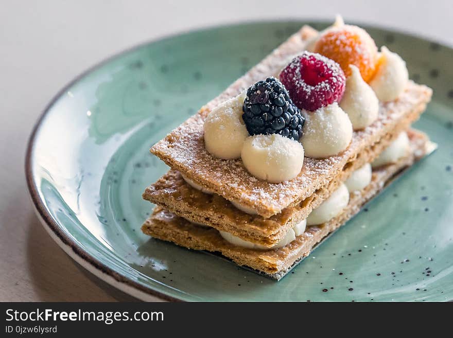 Beautifully decorated cream slice on plate at a bakery shop in Minsk, Belarus. Beautifully decorated cream slice on plate at a bakery shop in Minsk, Belarus.