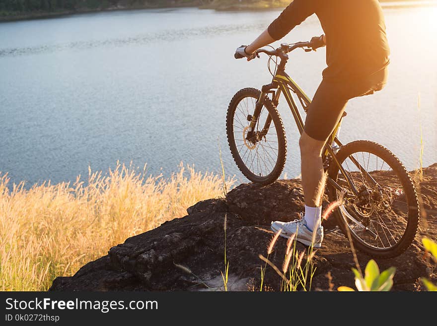 Cyclist on the mountain top of lake, Extreme and adventure life.