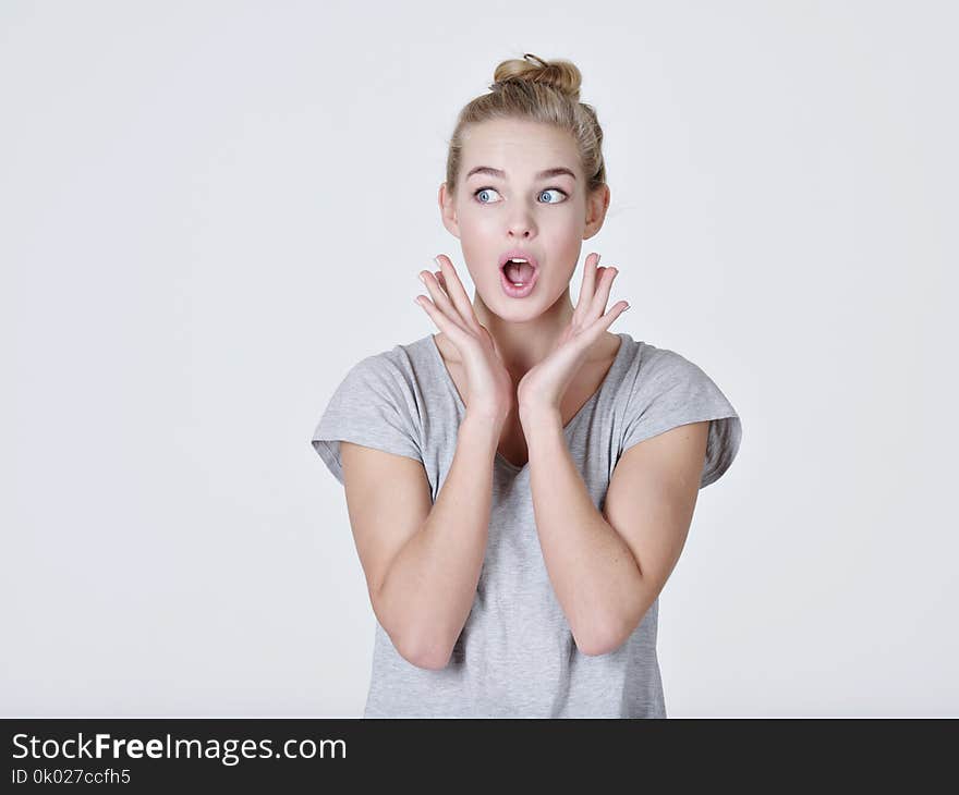 Young Shocked Woman On White Background