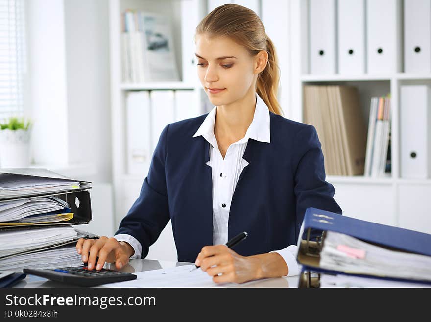 Modern business woman or confident female accountant in office. Student girl during exam preparing. Audit, tax service or education concept.