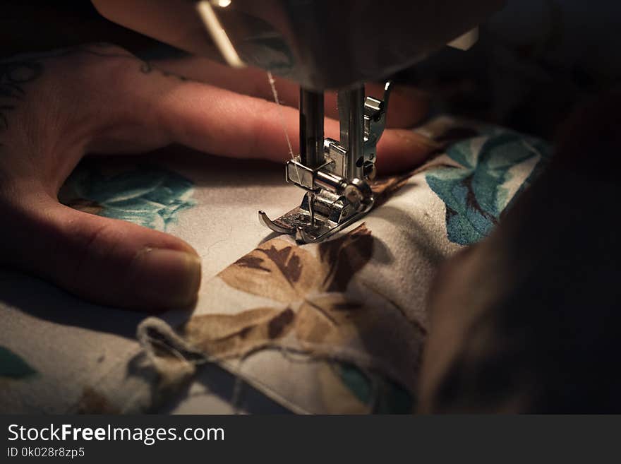 Tailor at work on sewing machine