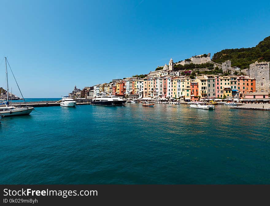 Beautiful medieval fisherman town of Portovenere bay near Cinque Terre, Liguria, Italy. Harbor wit boats and yachts. People are unrecognizable. Beautiful medieval fisherman town of Portovenere bay near Cinque Terre, Liguria, Italy. Harbor wit boats and yachts. People are unrecognizable.