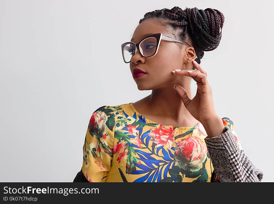 Photo of Woman Wearing Yellow Floral Top