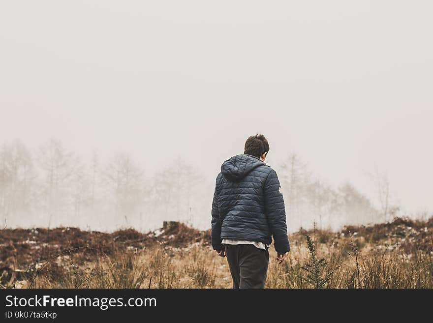 Man Wearing Blue Bubble Jacket