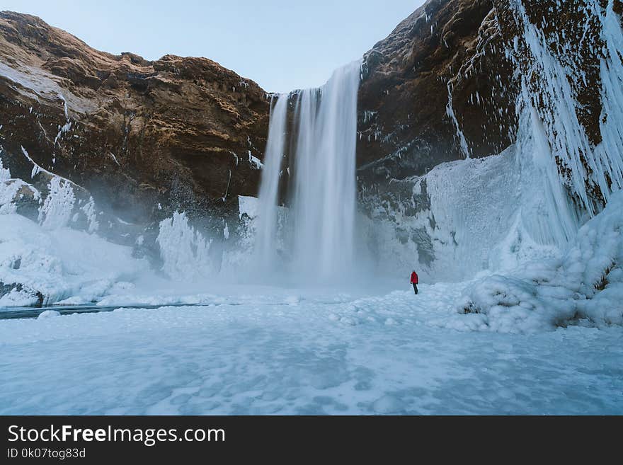 Person Walking on Snowfield