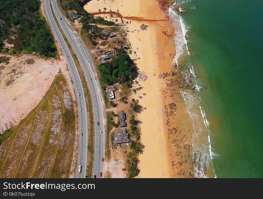 Aerial View of Road Beside the Seashore