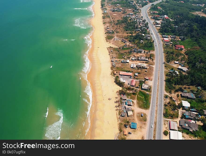 Top View of Blue Sea and Brown Sand