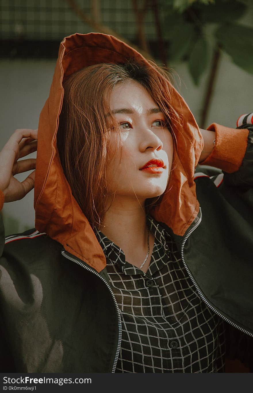 Woman Wearing Orange and Black Zip-up Jacket