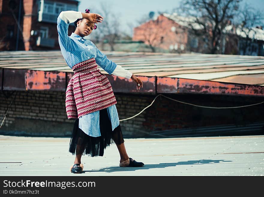 Depth of Field Photography of Woman Wearing Teal Dress