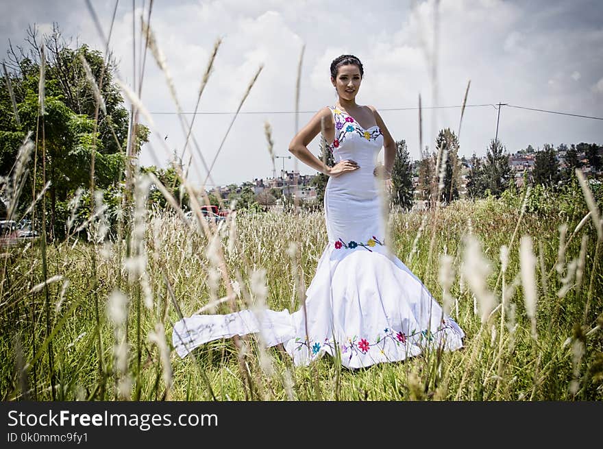 Woman Standing on Grass Field Wearing Mermaid Dress