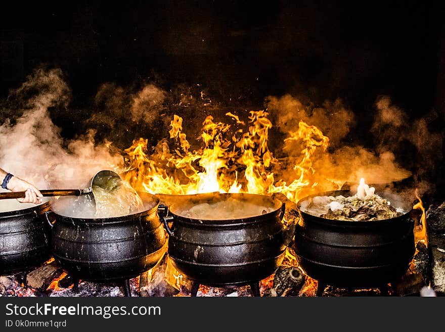 Time Lapse Photography of Four Black Metal Cooking Wares