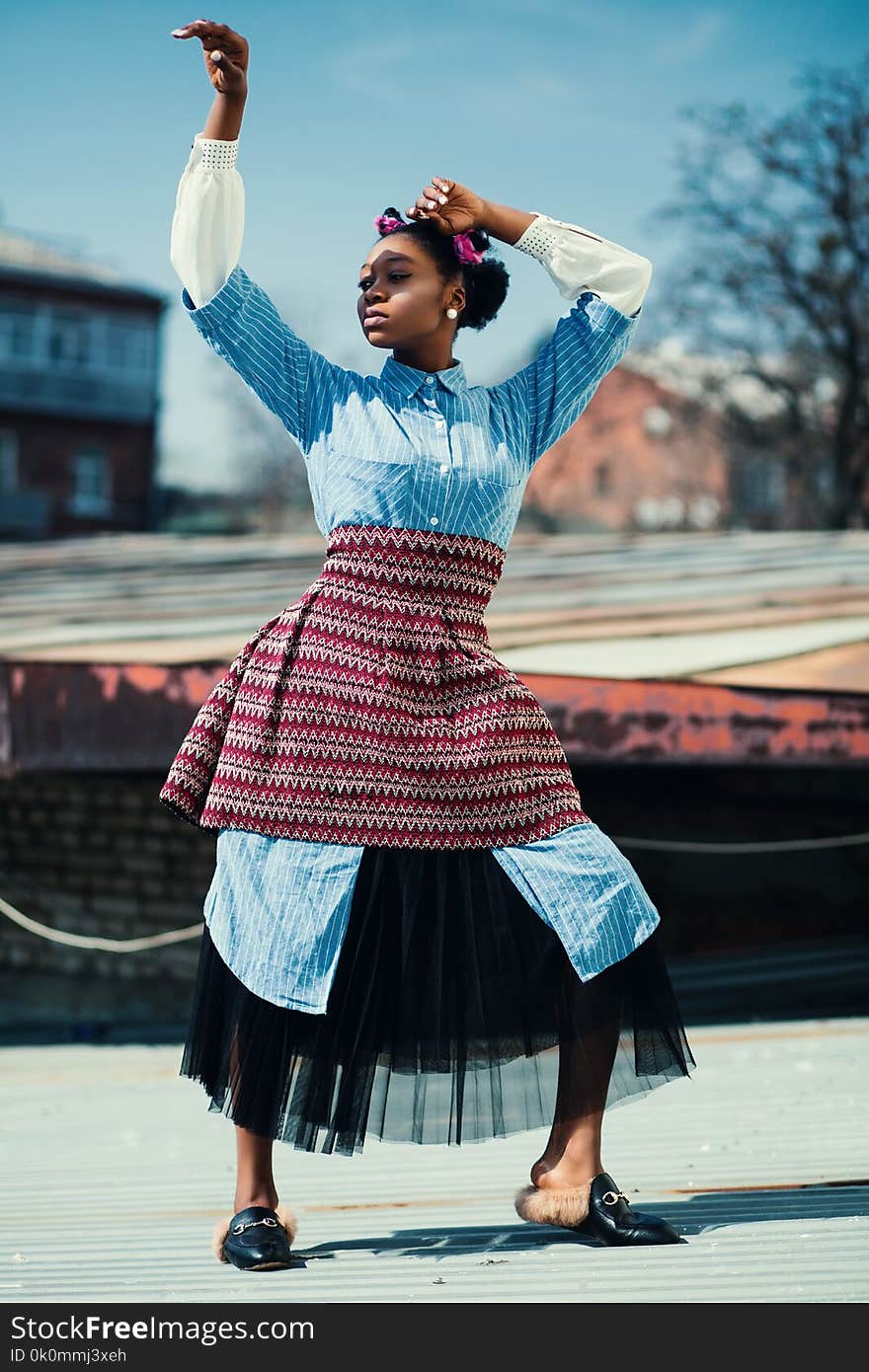 Woman Wearing Blue and Maroon Dress