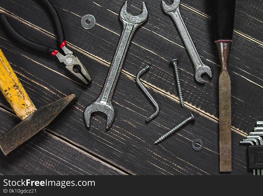 Joinery tools on a dark wooden table. Place for the text. A conc