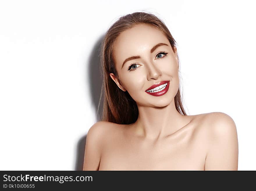 smiling woman with Glamour Red Lips, bright Makeup, clean Skin. Smile with White Teeth. Happy Fashion Girl