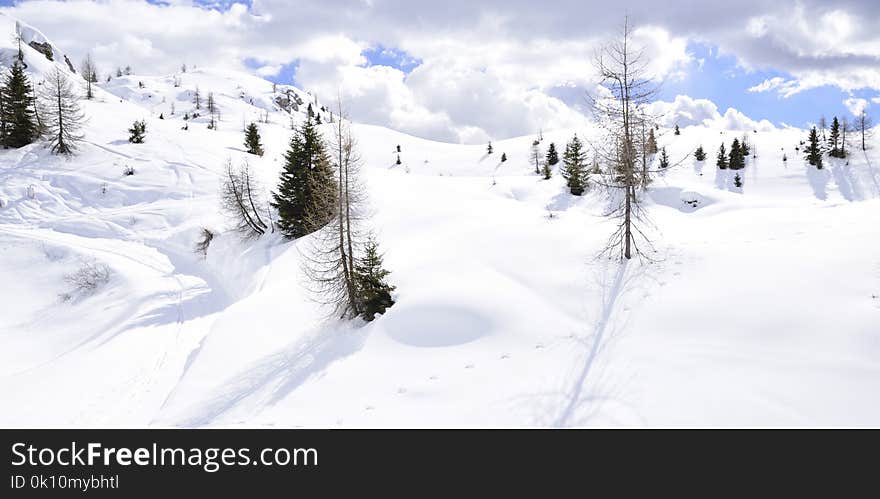 The peaks of the Alps in winter with soft snow