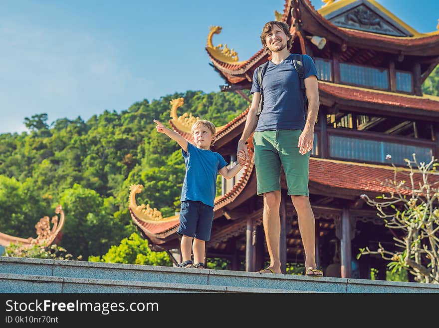 Happy tourists dad and son in Pagoda. Travel to Asia concept. Traveling with a baby concept