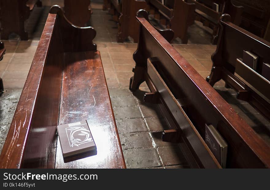 Single bible sitting on pew at church. Single bible sitting on pew at church