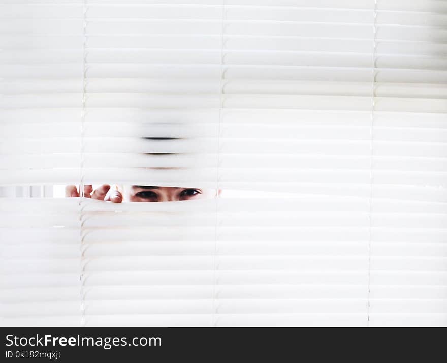 Photography of Person Peeking