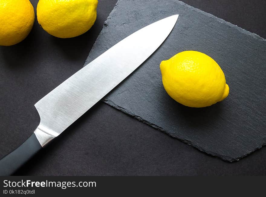 Photography of Lemon Near Kitchen Knife