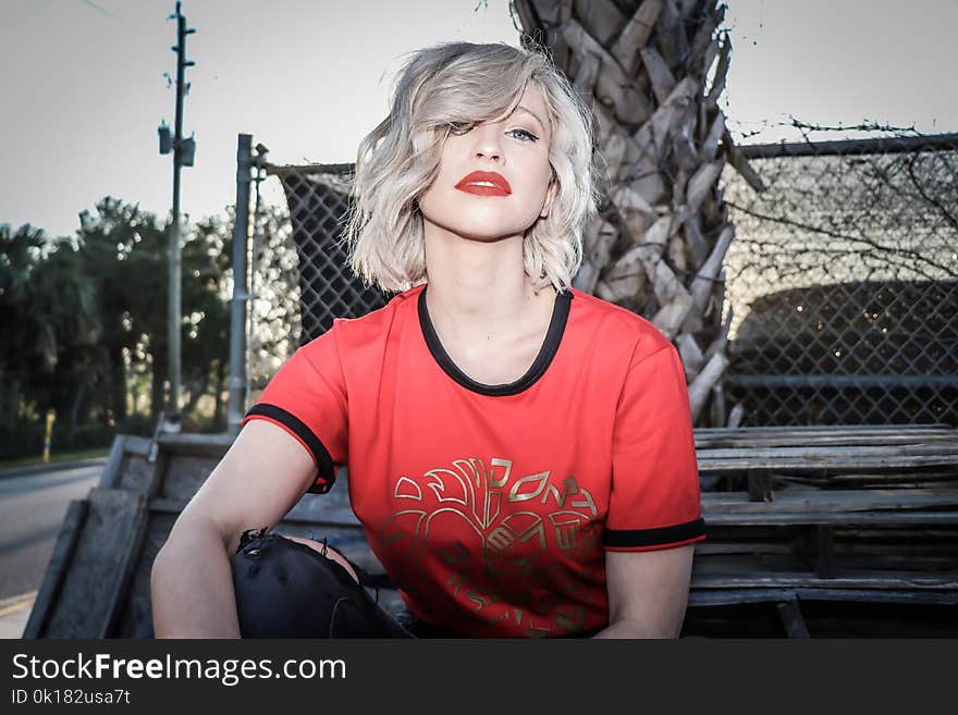 Woman in Red and Black Crew-neck T-shirt