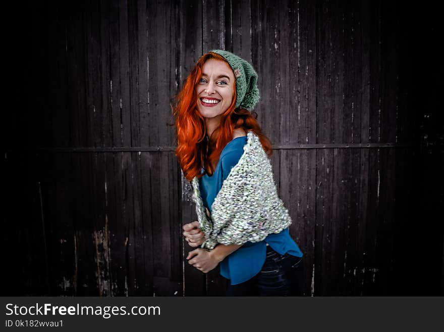 Woman in Blue Shirt an White Scarf With Red Hair