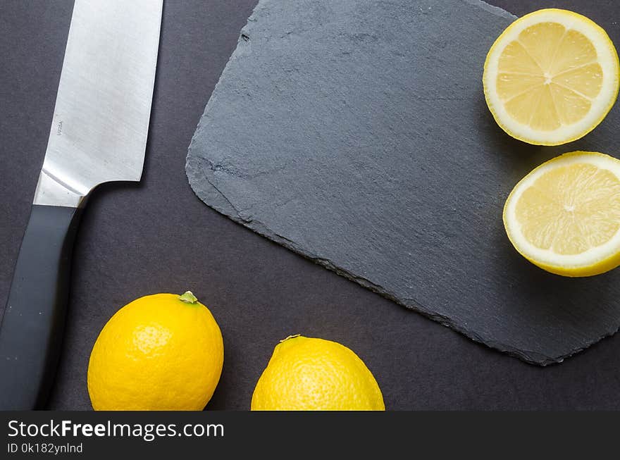 Photography of Sliced Lemon Near Kitchen Knife