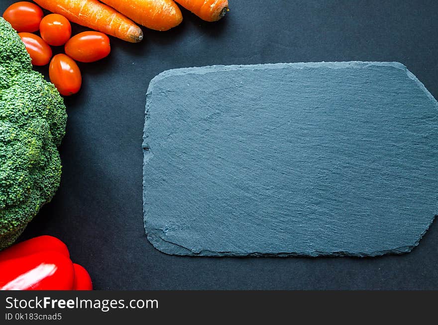 Gray Chapping Board Beside Vegetables