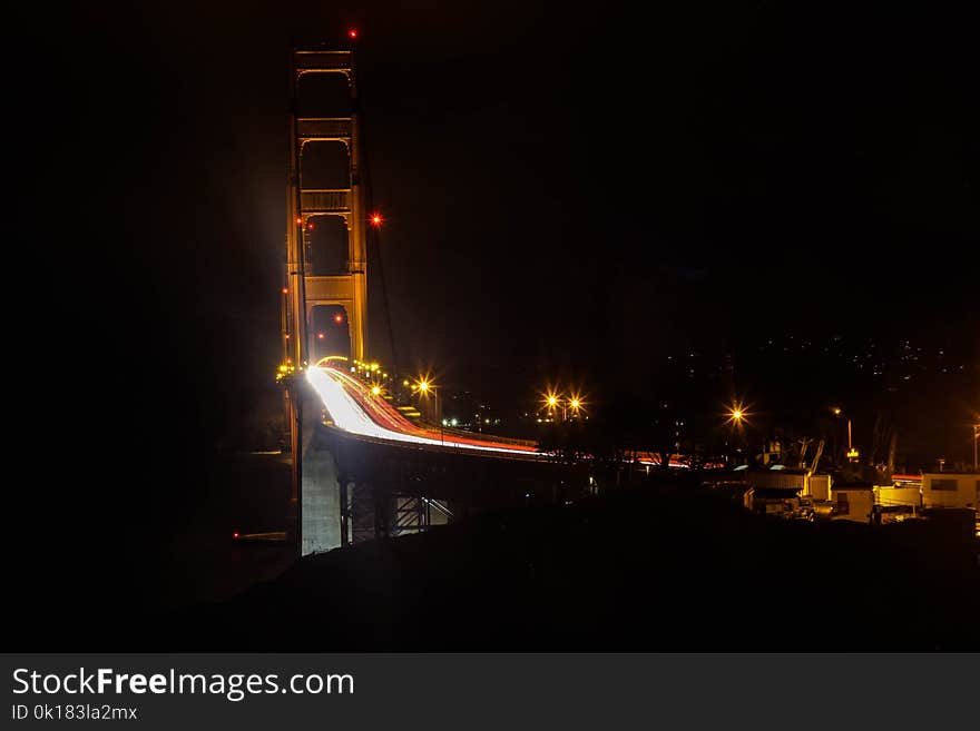 Photography of Bridge at Night