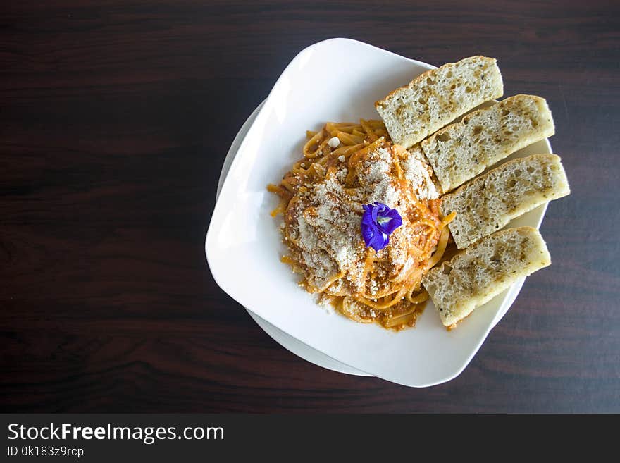 Photography of Pasta with Garlic Bread