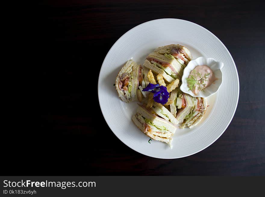 Sliced Clubhouse on Round White Ceramic Plate