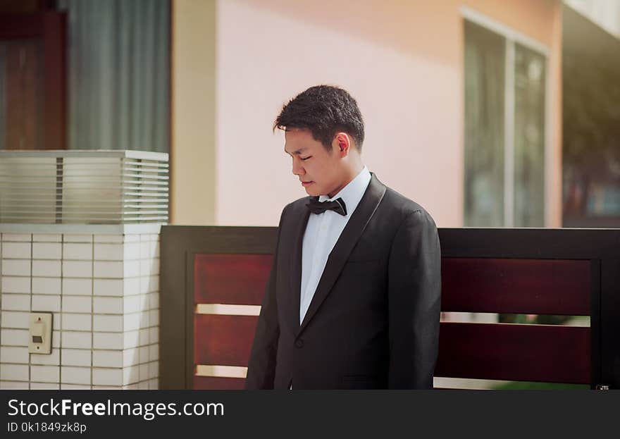 Photo of the Groom Wearing His Tuxedo