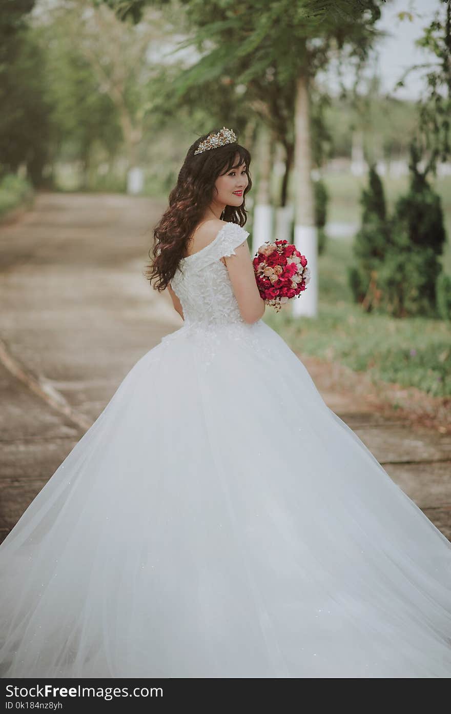 Photo of a Woman in Her Wedding Dress