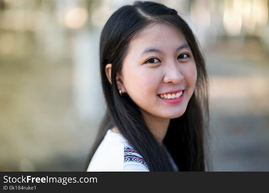 Close-Up Photography of a Woman Smiling