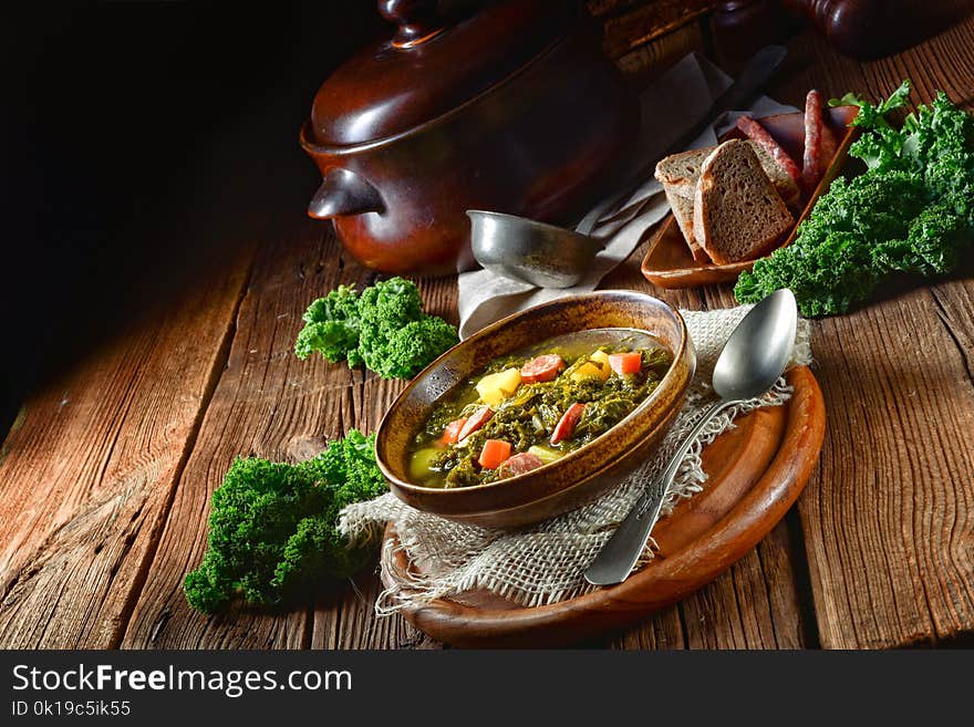 Rustic kale soup with meat and sausage